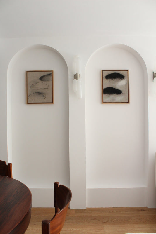 Three black clouds on linen