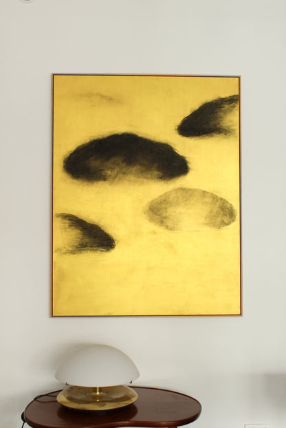 Black clouds on a gold background