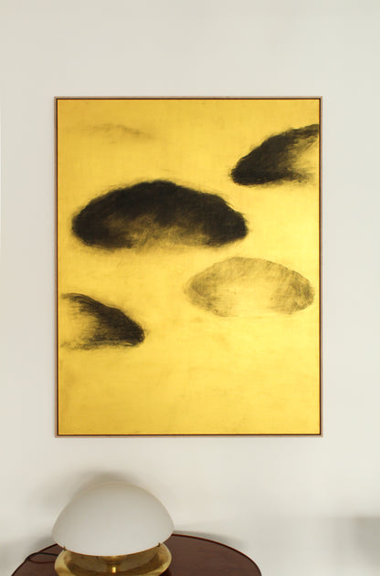 Black clouds on a gold background