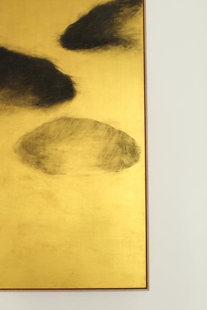 Black clouds on a gold background