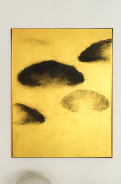 Black clouds on a gold background