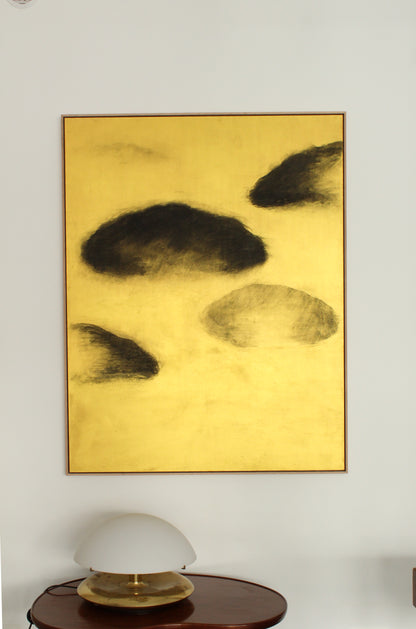 Black clouds on a gold background